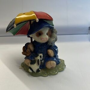 Charming Blue Figurine with Multicolor Umbrella